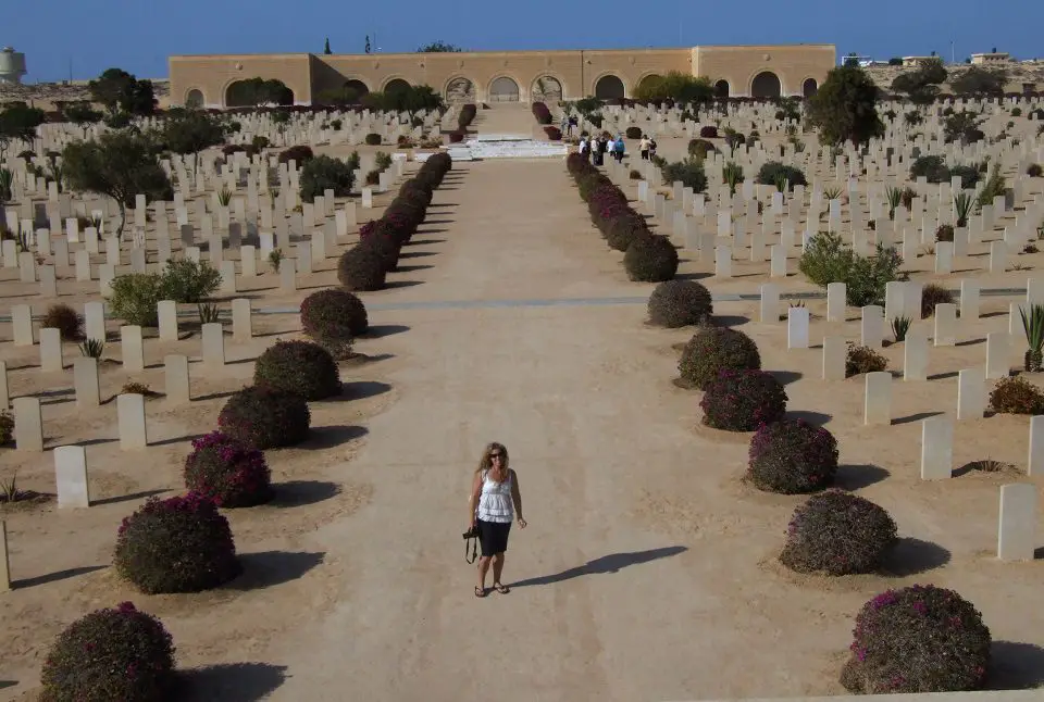 war cemetery in Egypt shows hundreds of graves with myself standing in the middle on a road 