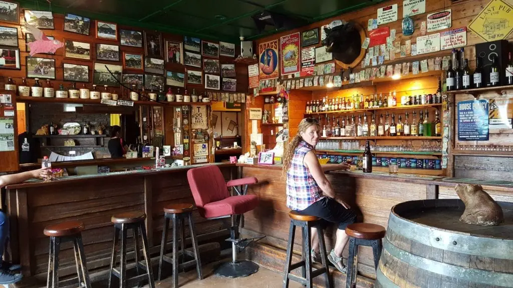 sitting in a bar with hundreds of bottles. Tasmania itinerary